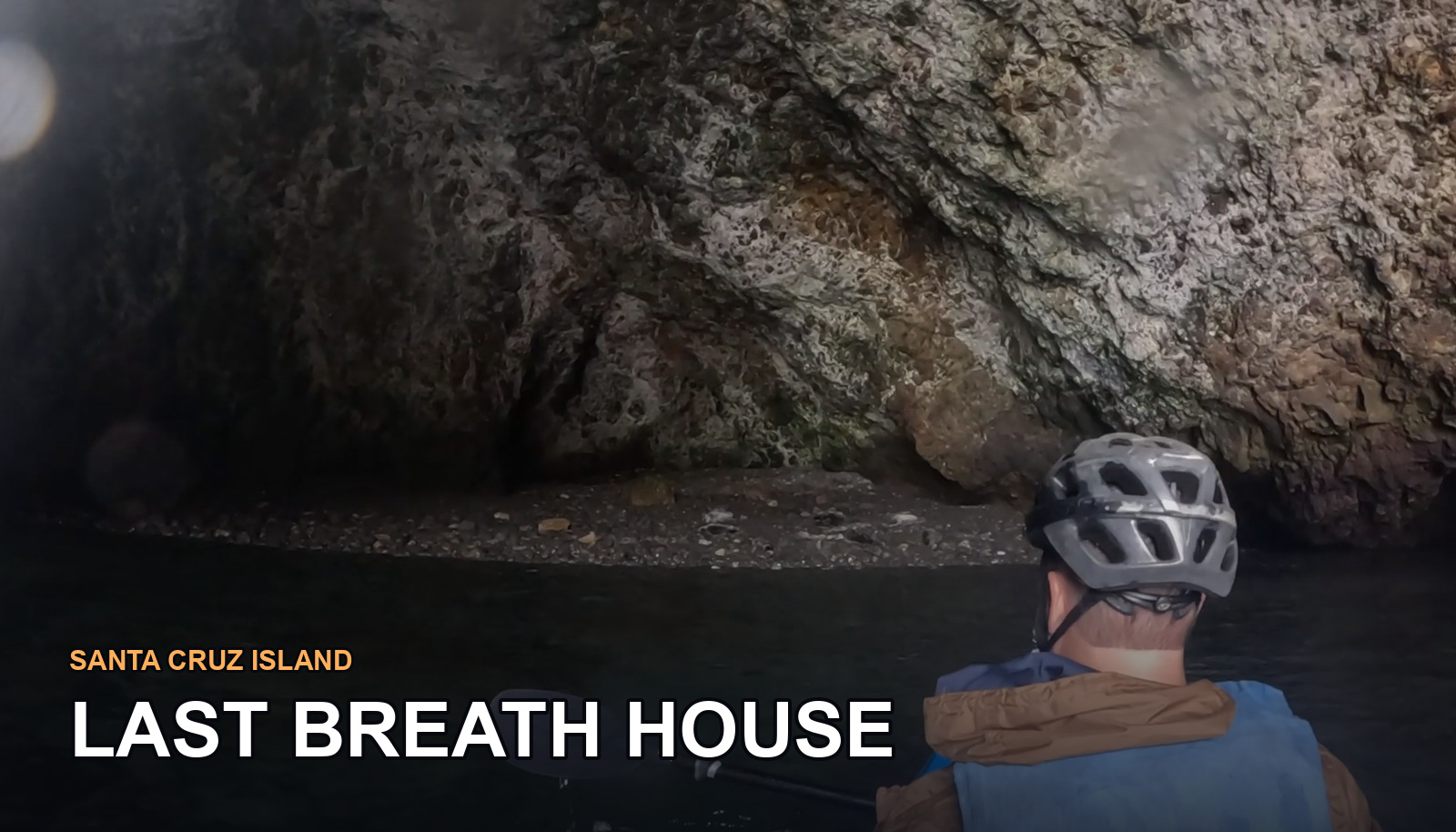A kayaker entering a sea cave at Santa Cruz Island